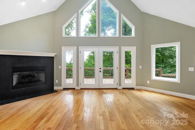 a view of an entryway with wooden floor