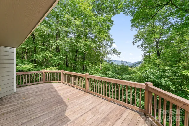 a view of balcony with deck and wooden floor