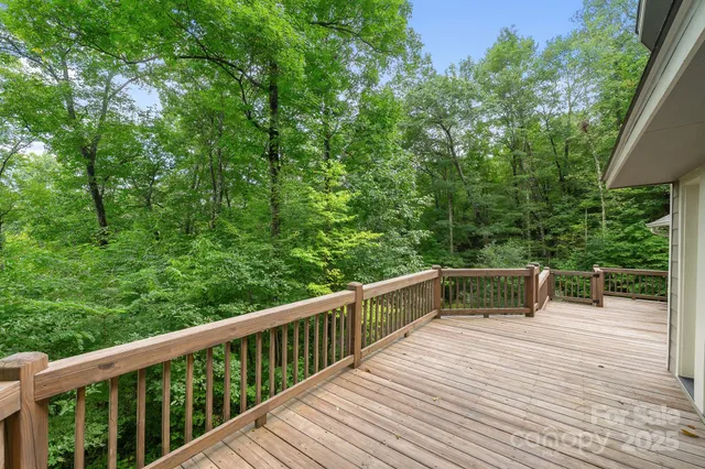 a balcony with wooden floor and wooden floor