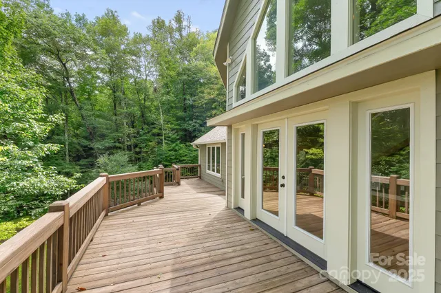 a view of balcony with wooden floor