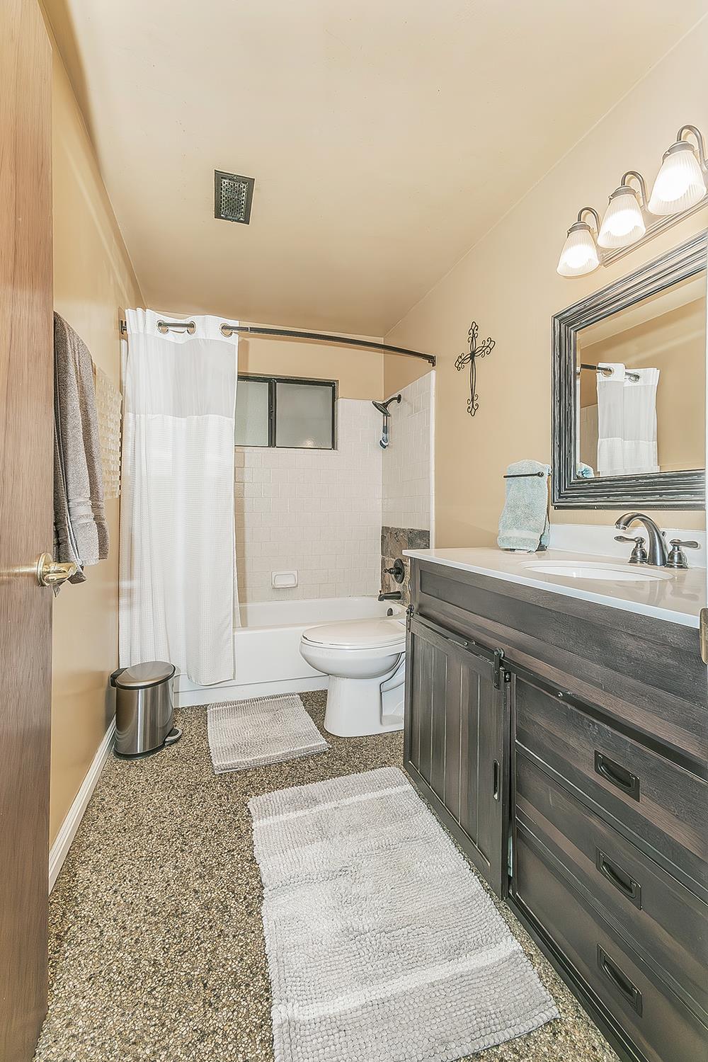29545 Oak Meadow Road Tollhouse, CA 93667 - Photo 37 of 69 a bathroom with a sink a toilet and a mirror