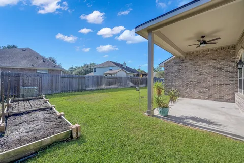 a view of a backyard with a garden