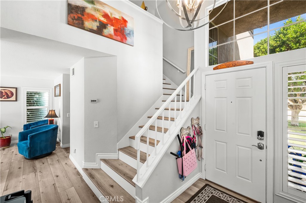 19465 Kinnow Lane Riverside, CA 92508 - Photo 22 of 61 a view of an entryway with wooden floor and windows