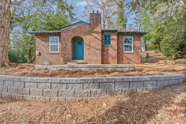 a front view of a house with garden