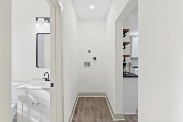 a backyard of a house with large trees and wooden fence