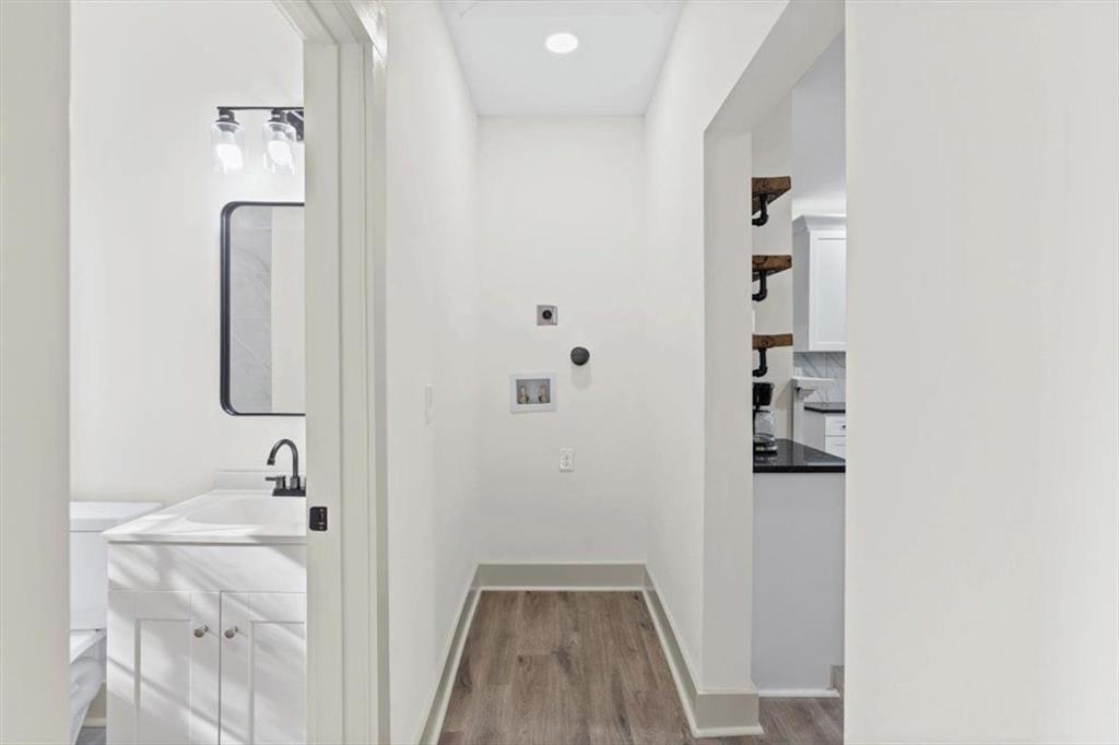 203 Church Street Northeast Rome, GA 30161 - Photo 18 of 36 a bathroom with a sink a mirror and a shower