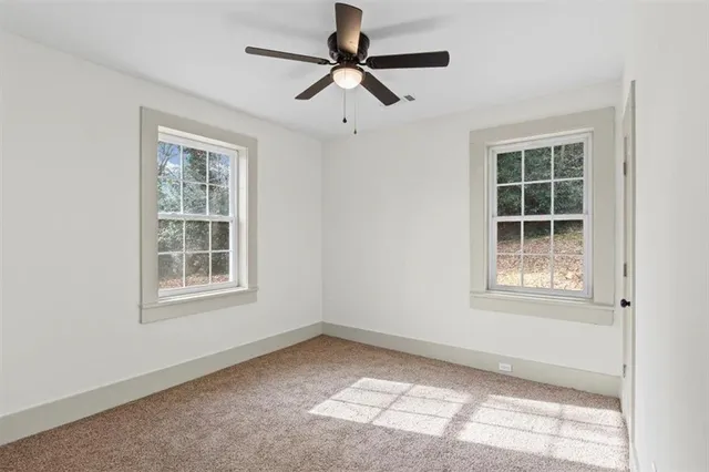 a backyard of a house with lots of green space