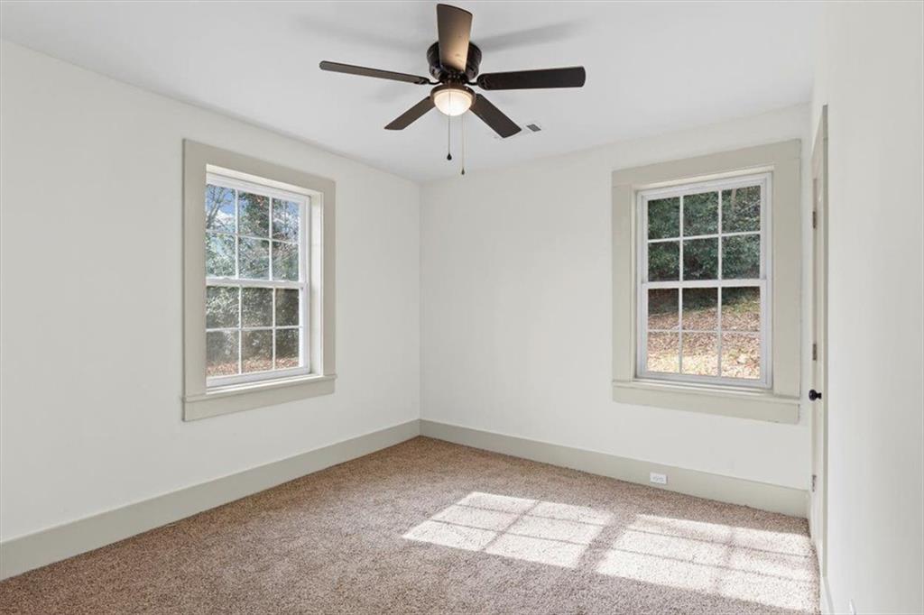 203 Church Street Northeast Rome, GA 30161 - Photo 19 of 36 an empty room with windows and fan