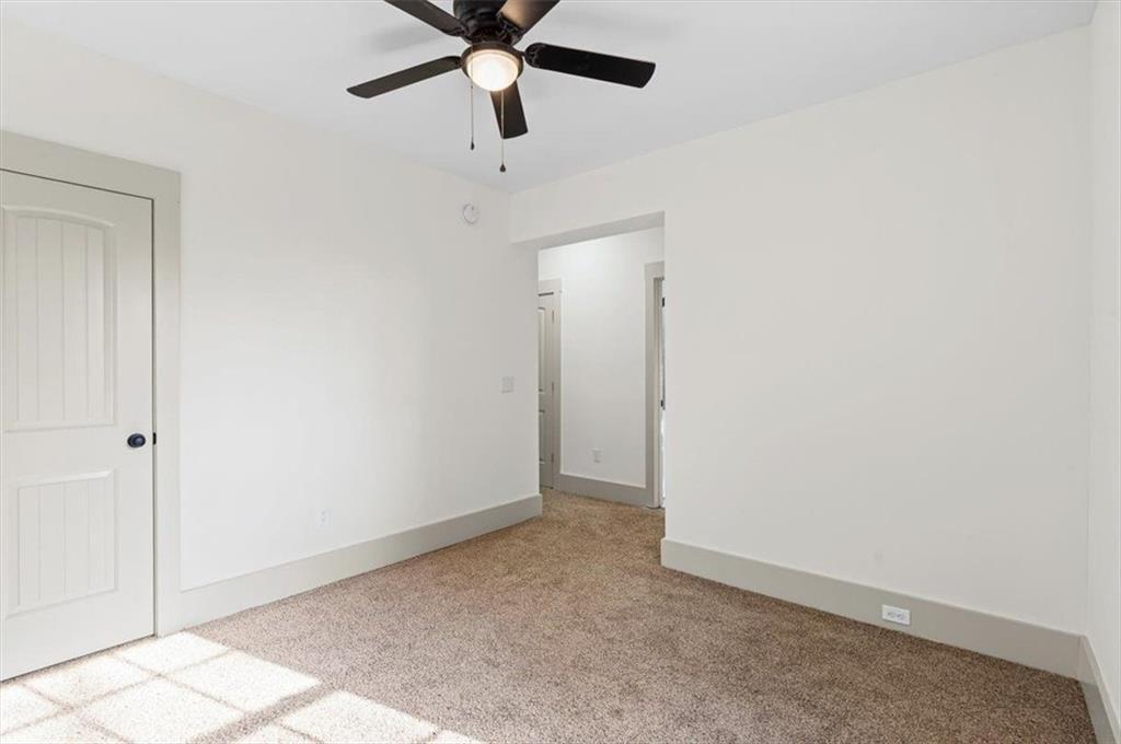203 Church Street Northeast Rome, GA 30161 - Photo 20 of 36 an empty room with a ceiling fan