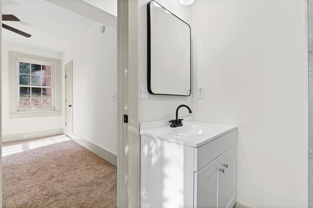 203 Church Street Northeast Rome, GA 30161 - Photo 21 of 36 a bathroom with a sink and a mirror