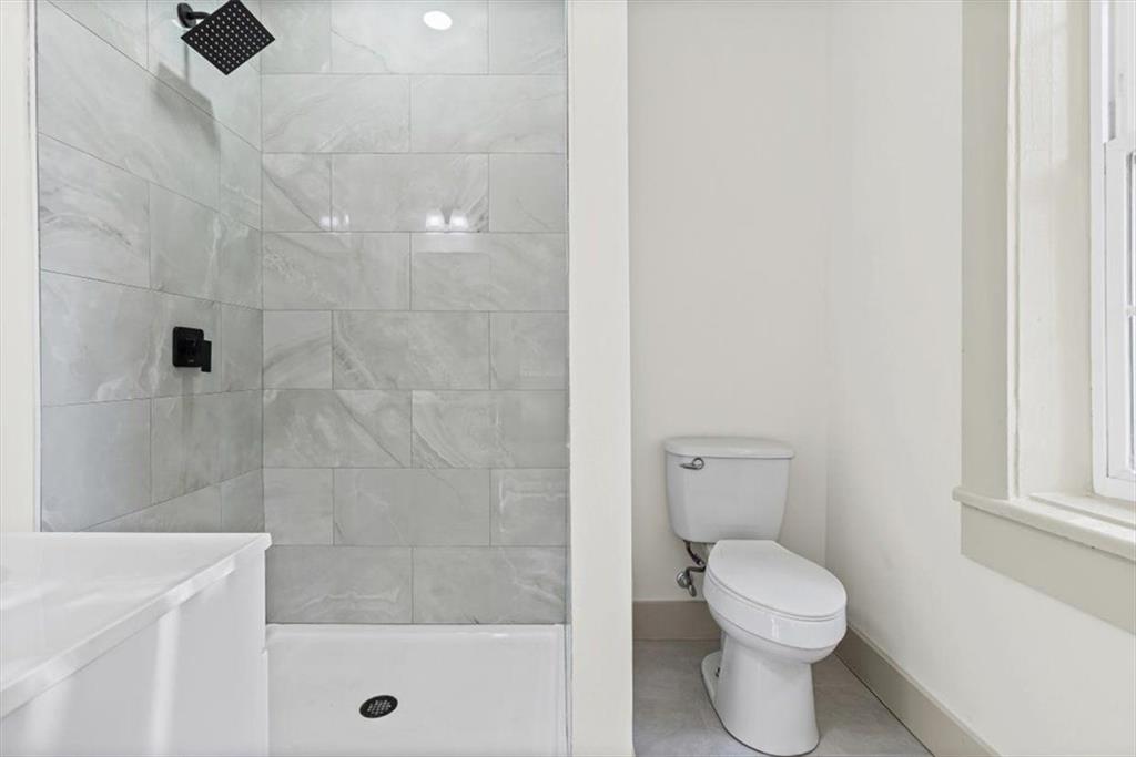 203 Church Street Northeast Rome, GA 30161 - Photo 22 of 36 a bathroom with a shower and a toilet