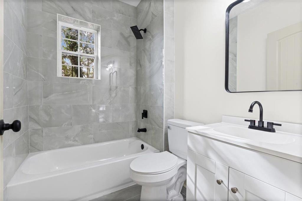 203 Church Street Northeast Rome, GA 30161 - Photo 25 of 36 a bathroom with a sink a toilet and a bathtub