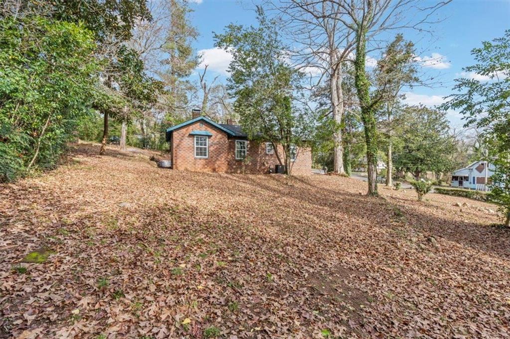 203 Church Street Northeast Rome, GA 30161 - Photo 27 of 36 a house with a tree in front of it