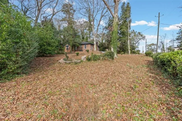 a kitchen with stainless steel appliances kitchen island granite countertop a stove a sink and a refrigerator