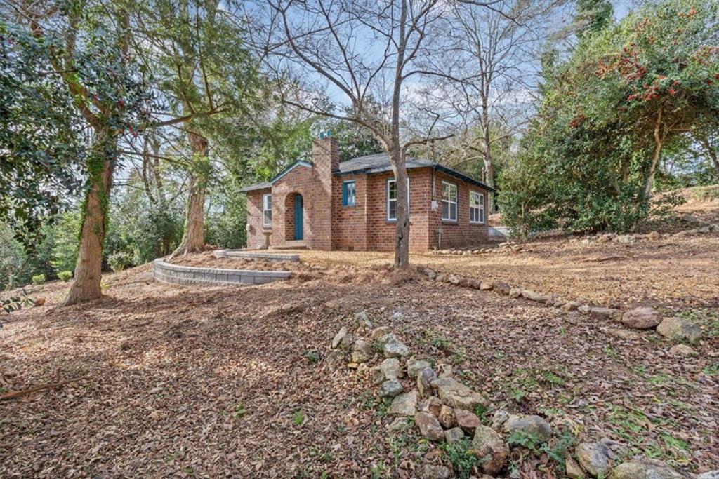 203 Church Street Northeast Rome, GA 30161 - Photo 5 of 36 a house that has a tree in front of it