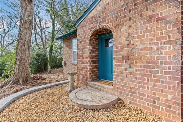 a kitchen with a refrigerator stove and white cabinets