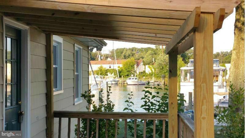 4807 Woods Wharf Road Shady Side, MD 20764 - Photo 11 of 12 a view of a glass door with a balcony