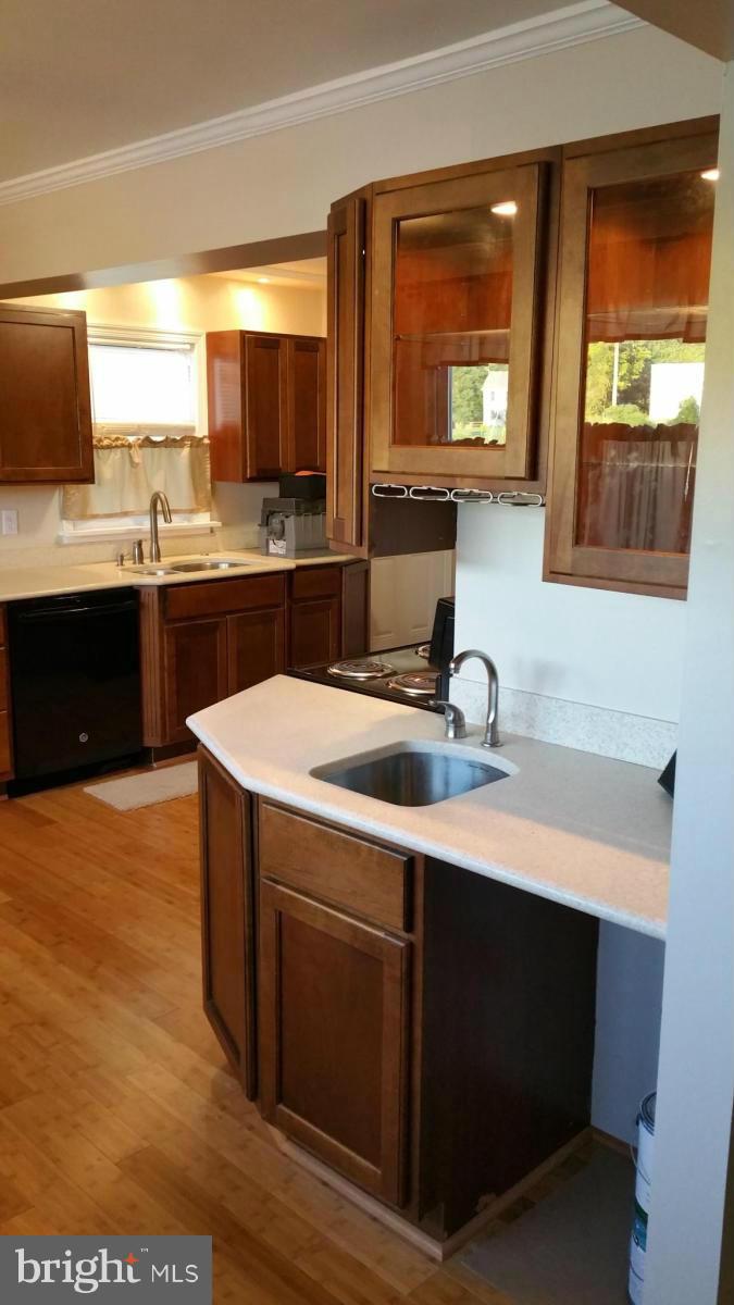 4807 Woods Wharf Road Shady Side, MD 20764 - Photo 7 of 12 a kitchen with a sink cabinets and window