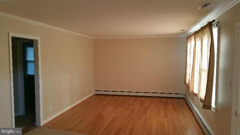 4807 Woods Wharf Road Shady Side, MD 20764 - Photo 10 of 12 a view of a room with wooden floor and windows