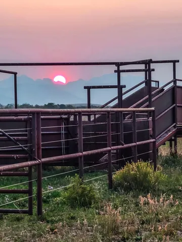 a bedroom with furniture and a flat screen tv