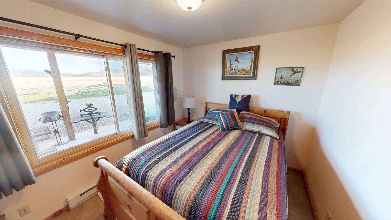 8325 County Rd M44 Placerville, CO 81430 - Photo 43 of 62 a bedroom with a bed and wooden floor