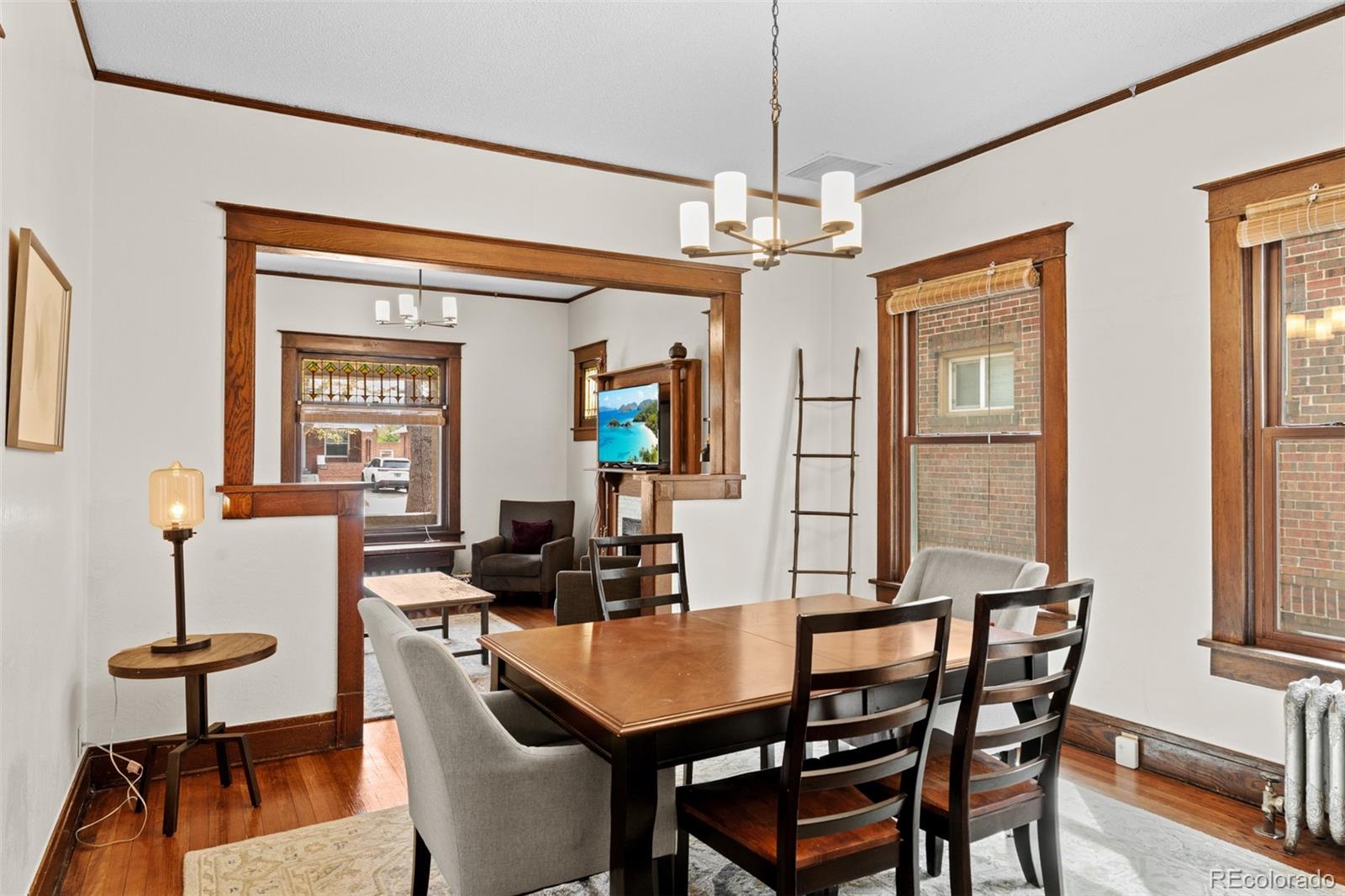 3517 York Street Denver, CO 80205 - Photo 12 of 45 a view of a dining room with furniture window and wooden floor