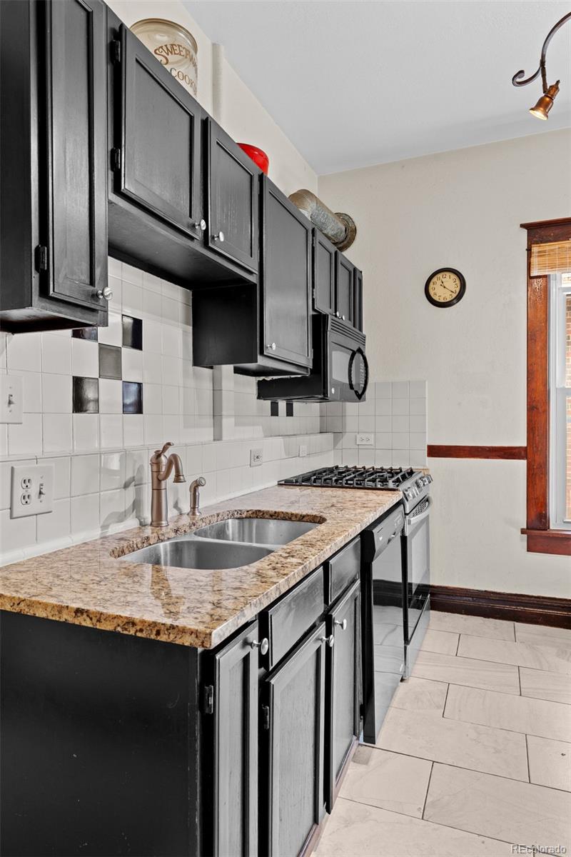 3517 York Street Denver, CO 80205 - Photo 15 of 45 a kitchen with stainless steel appliances granite countertop a sink stove and cabinets