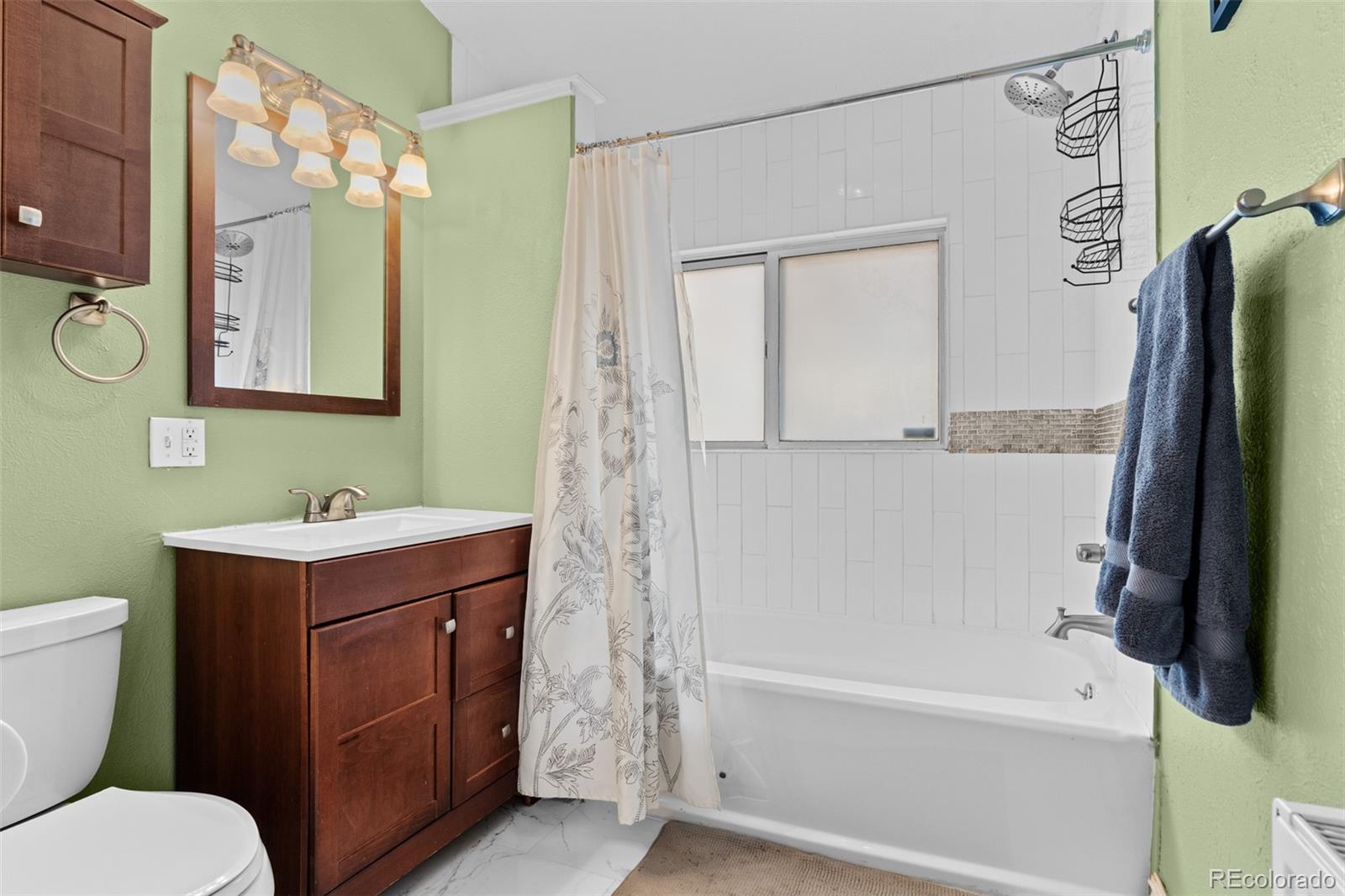 3517 York Street Denver, CO 80205 - Photo 21 of 45 a bathroom with a sink a toilet and a bathtub