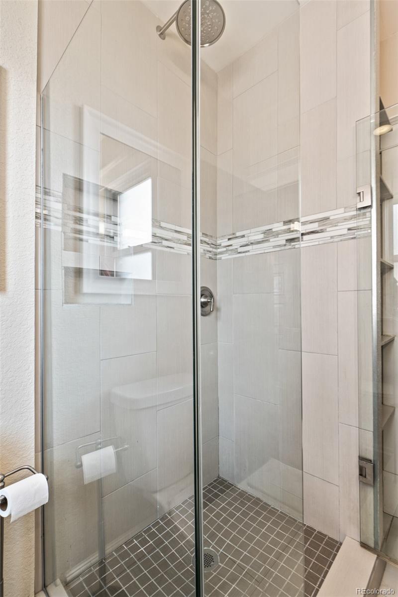 3517 York Street Denver, CO 80205 - Photo 25 of 45 a bathroom with a shower and a toilet