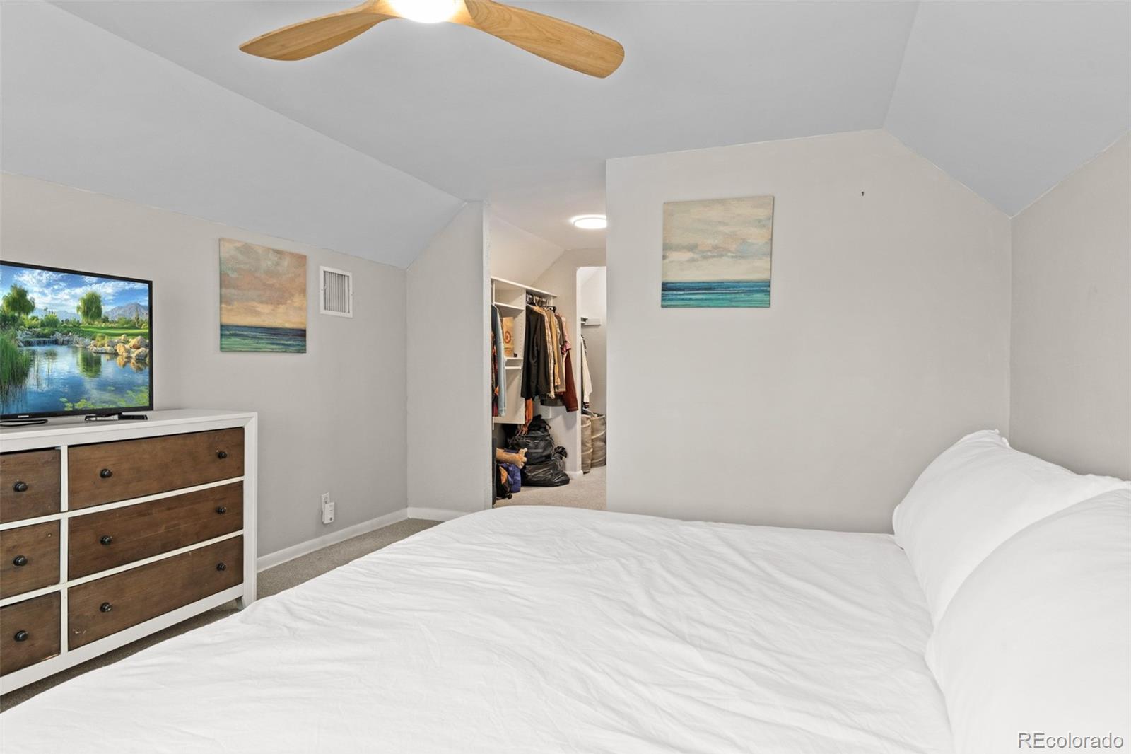 3517 York Street Denver, CO 80205 - Photo 27 of 45 a bedroom with a bed and a flat screen tv
