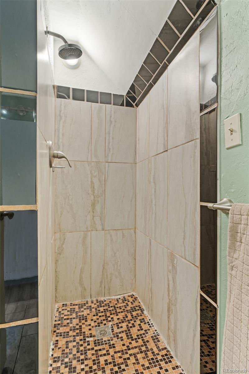 3517 York Street Denver, CO 80205 - Photo 29 of 45 a bathroom with a shower and a sink