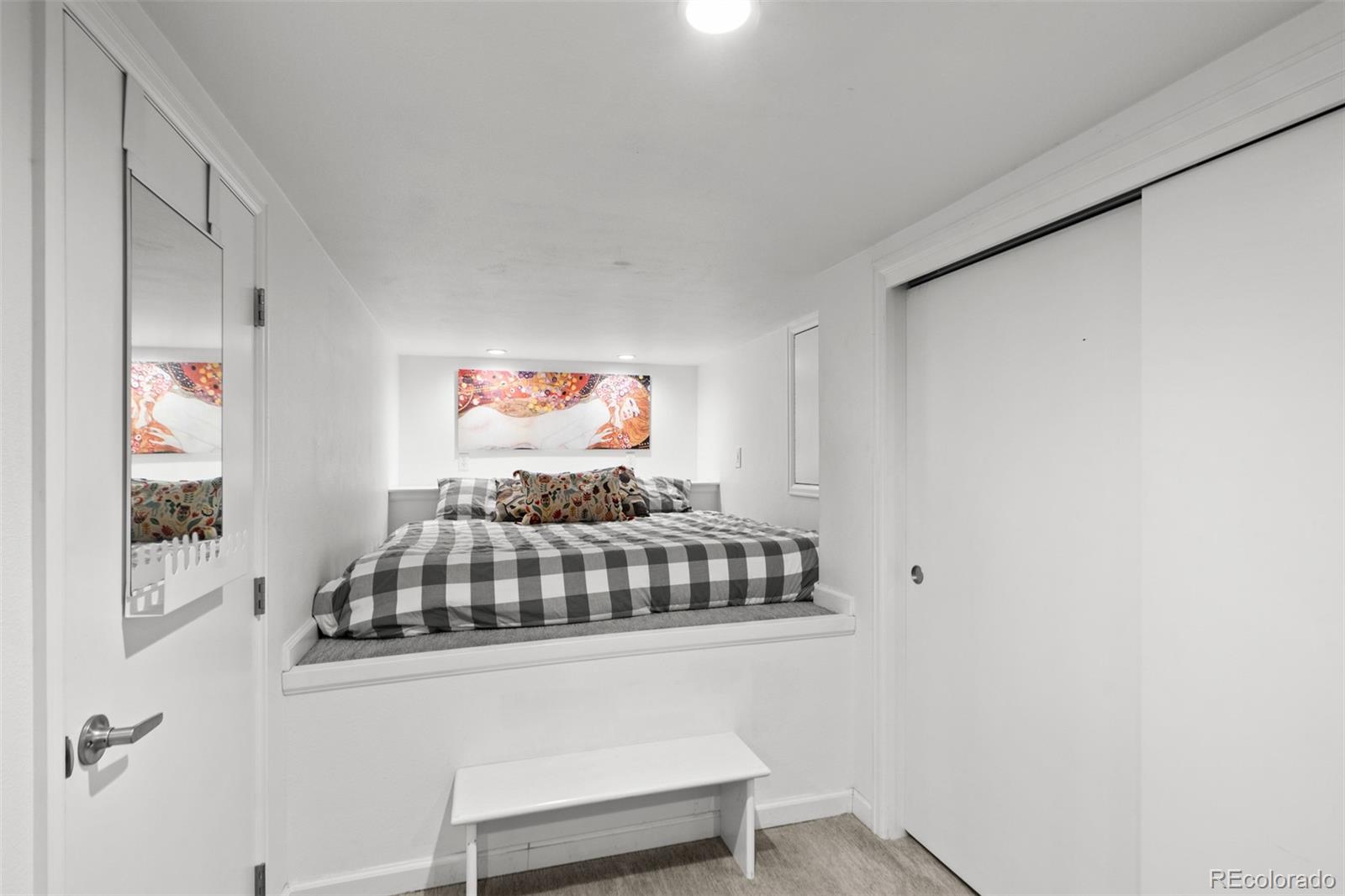 3517 York Street Denver, CO 80205 - Photo 33 of 45 a bedroom with a bed and a painting on the wall