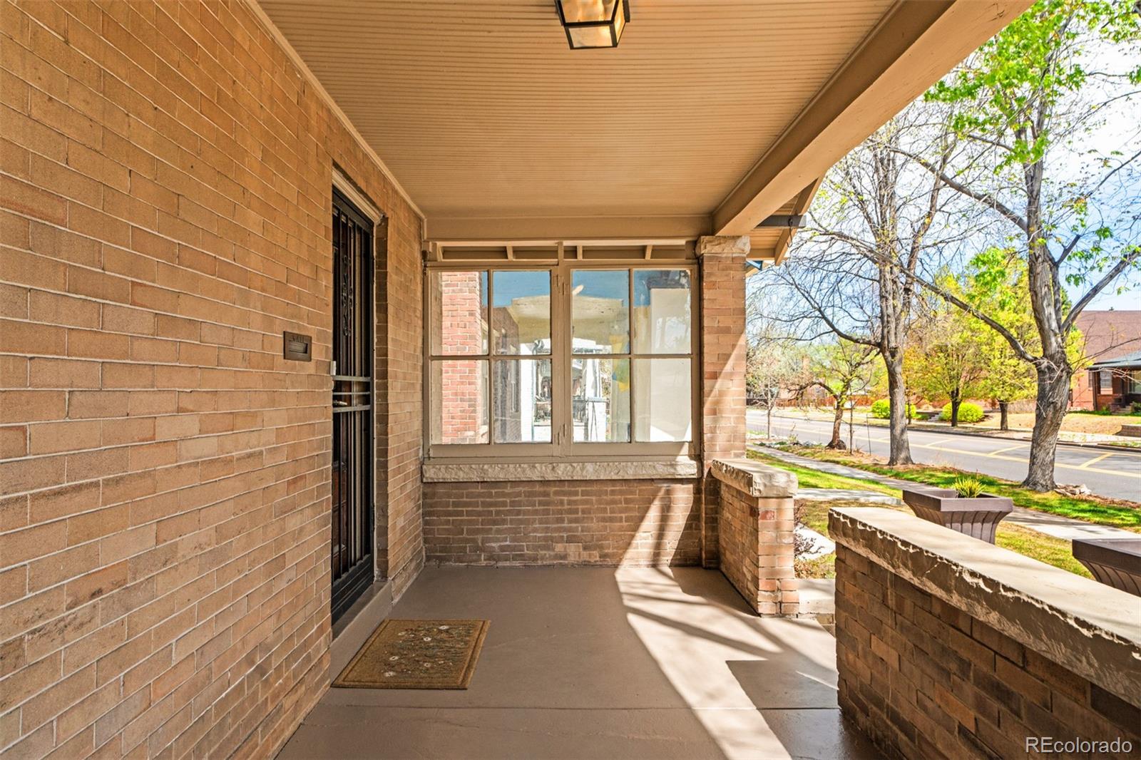 3517 York Street Denver, CO 80205 - Photo 4 of 45 a view of a brick house with a large window