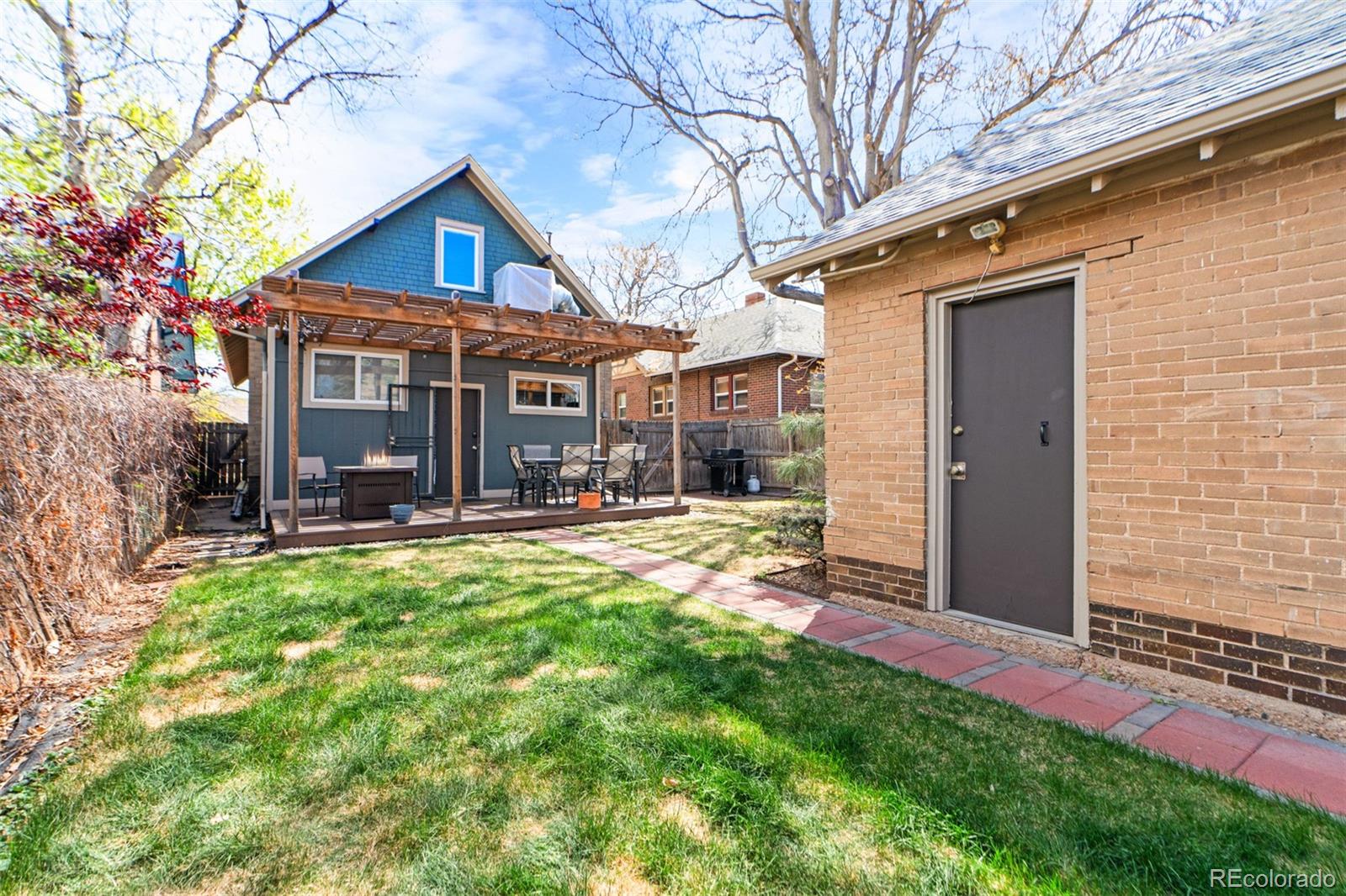 3517 York Street Denver, CO 80205 - Photo 41 of 45 a view of a house with backyard and porch