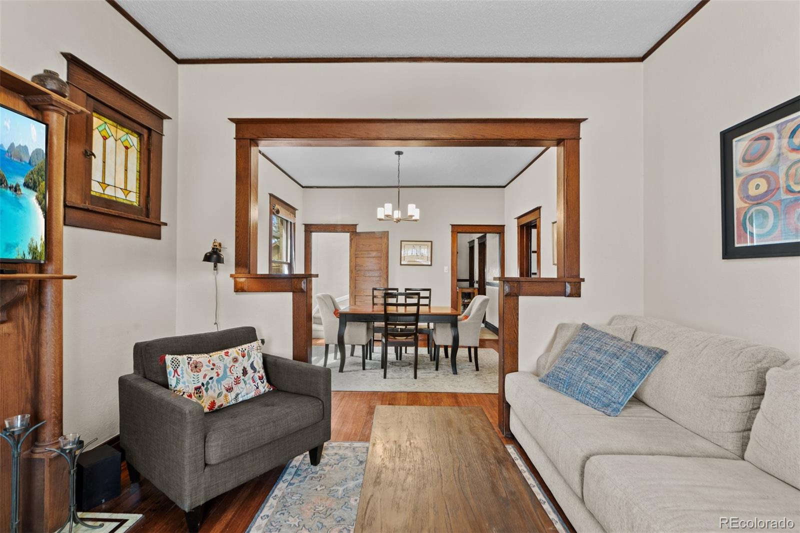 3517 York Street Denver, CO 80205 - Photo 10 of 45 a living room with furniture and a dining table