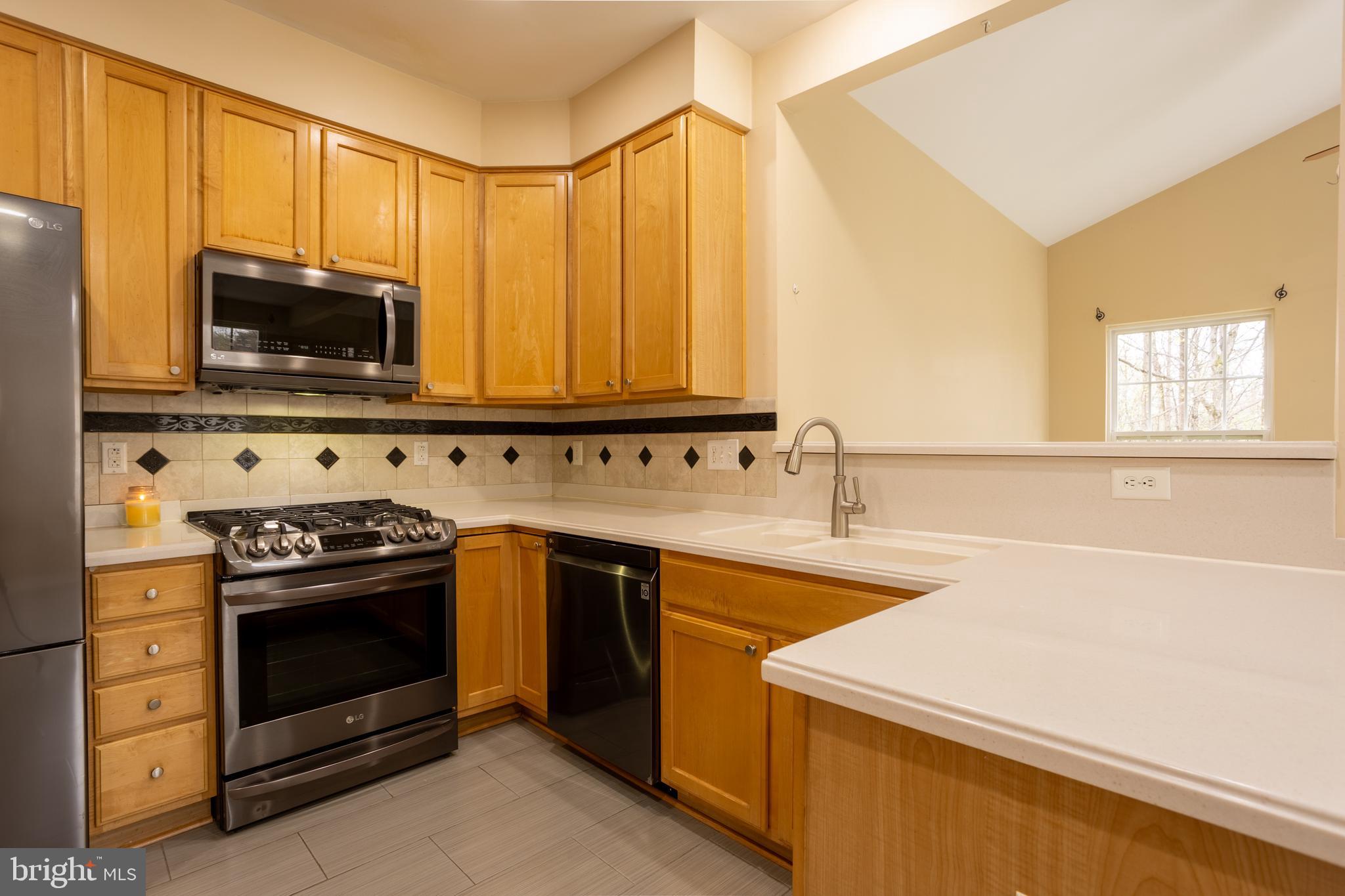 7740 Rotherham Drive Hanover, MD 21076 - Photo 13 of 62 a kitchen with a stove and a sink
