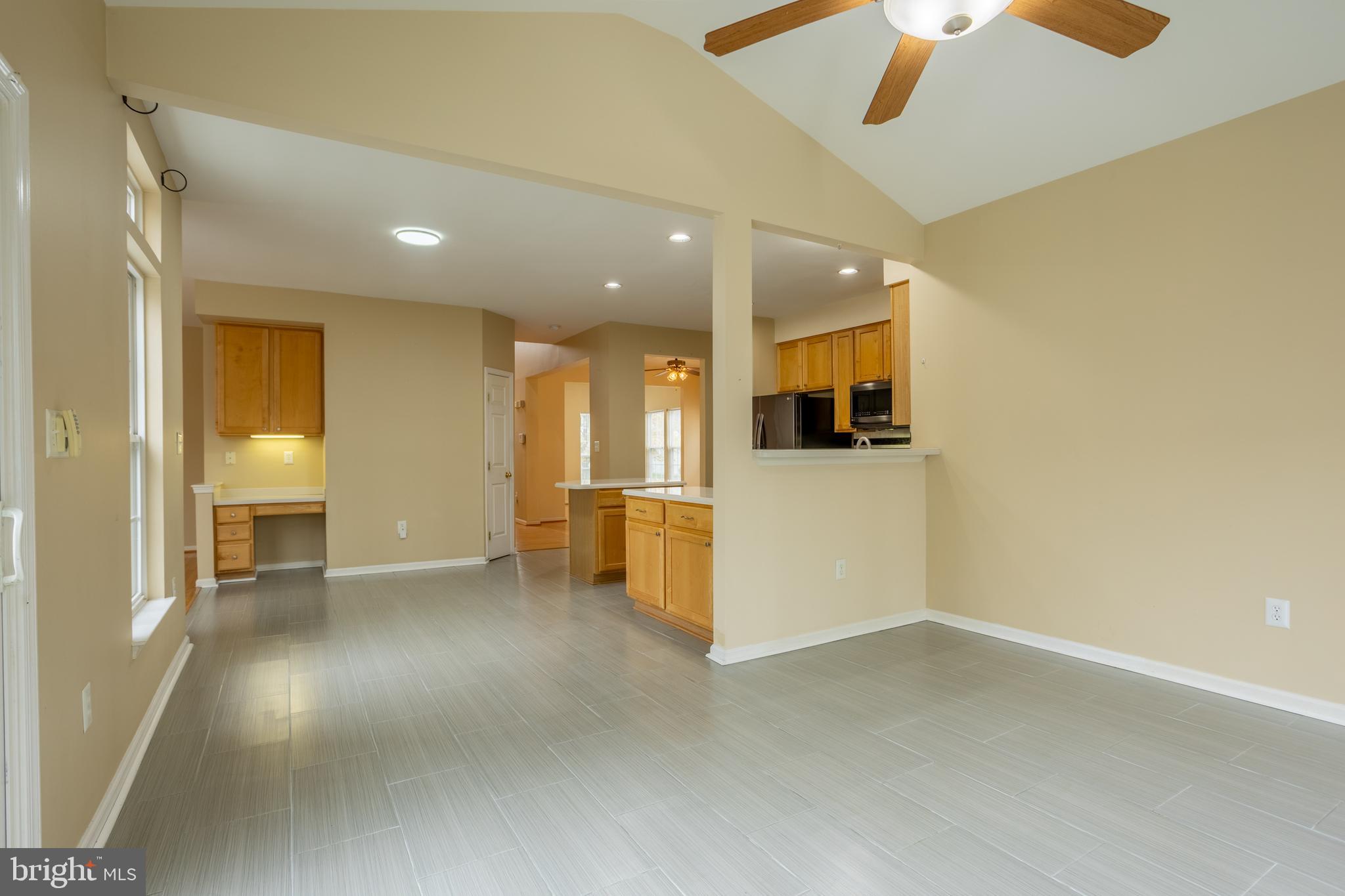 7740 Rotherham Drive Hanover, MD 21076 - Photo 16 of 62 an empty room with a empty space and a ceiling fan
