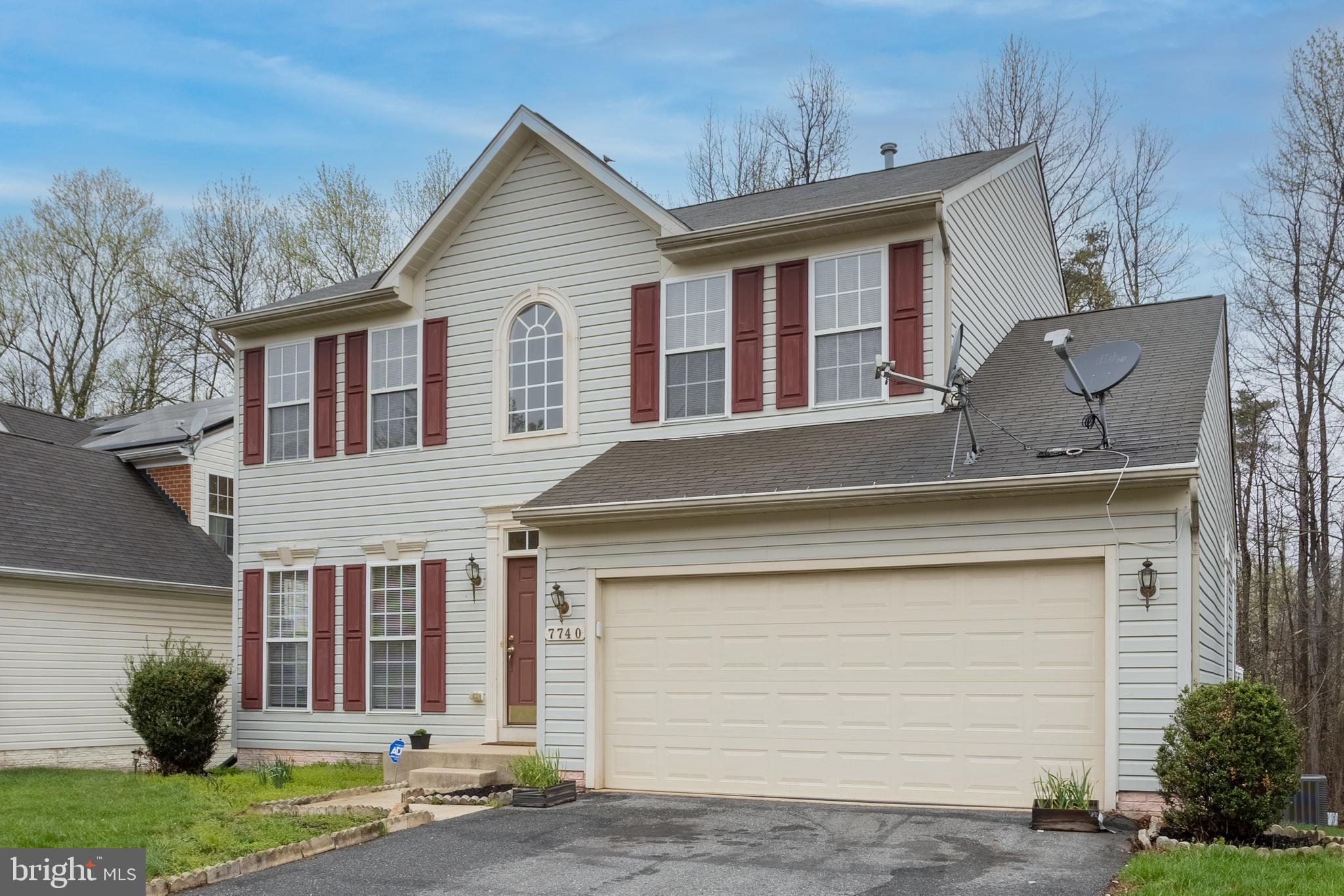 7740 Rotherham Drive Hanover, MD 21076 - Photo 2 of 62 a view of a white house next to a yard