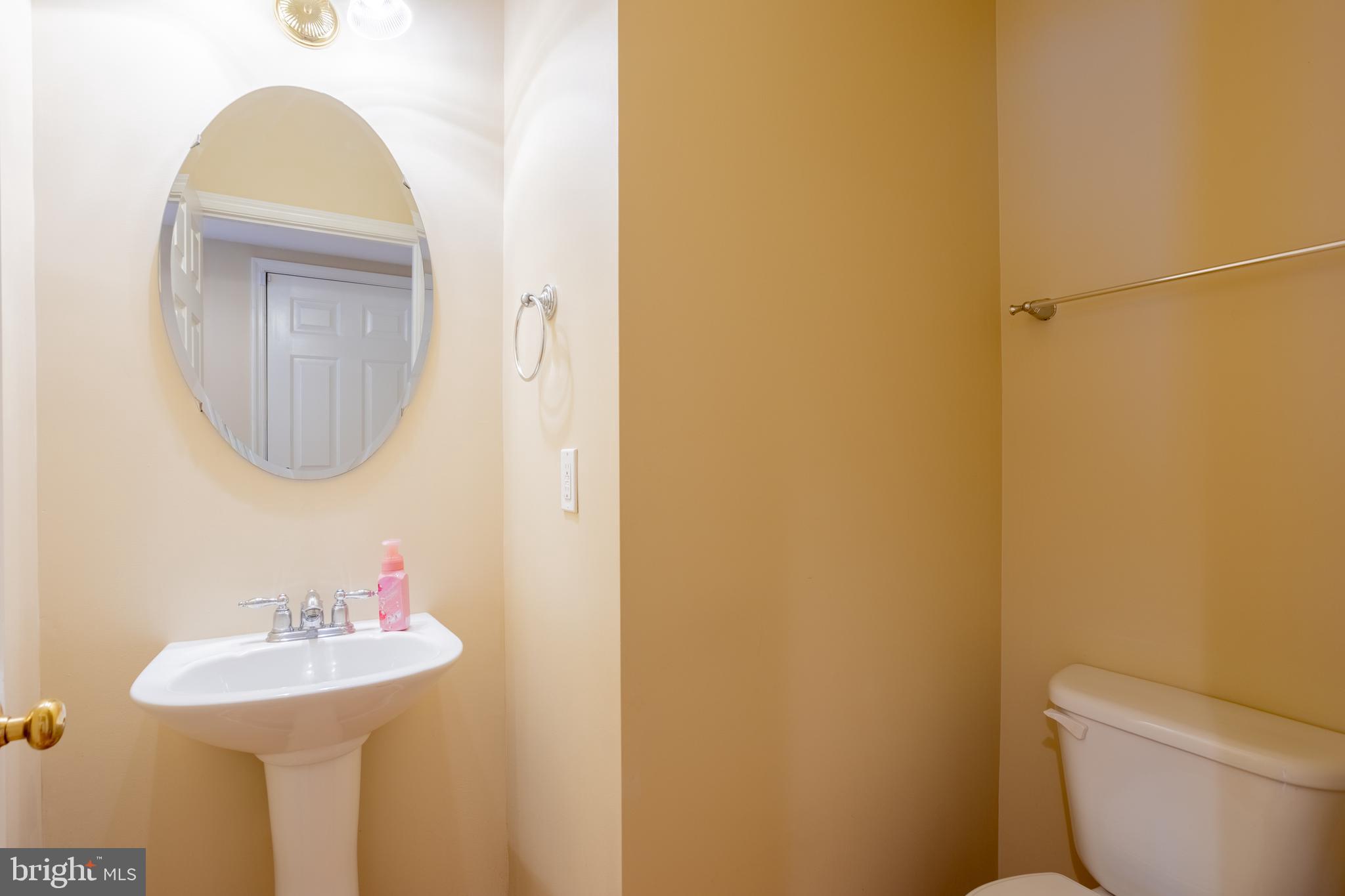7740 Rotherham Drive Hanover, MD 21076 - Photo 21 of 62 a bathroom with a sink and a mirror