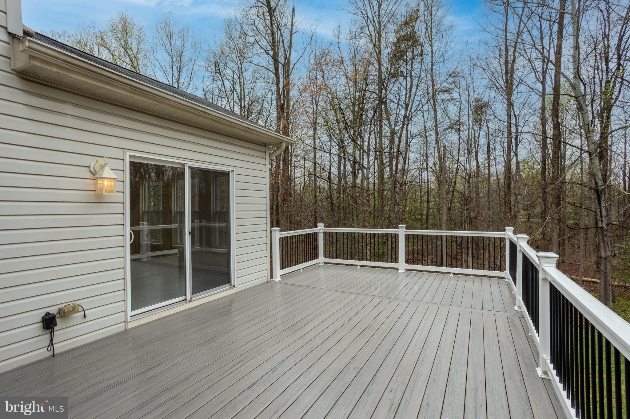 7740 Rotherham Drive Hanover, MD 21076 - Photo 23 of 62 a view of a roof deck with wooden floor and fence