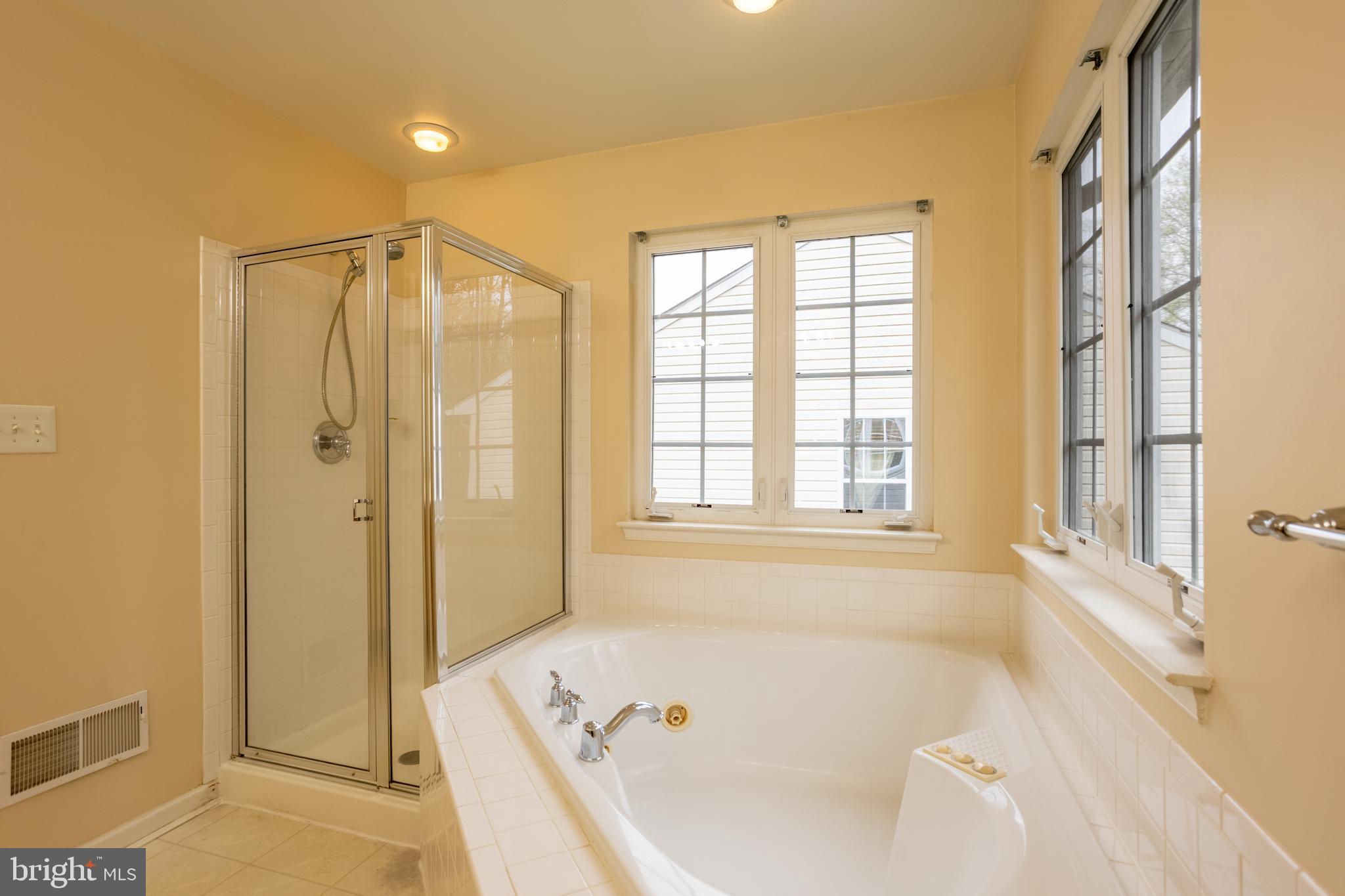 7740 Rotherham Drive Hanover, MD 21076 - Photo 30 of 62 a bathroom with a bathtub and a shower