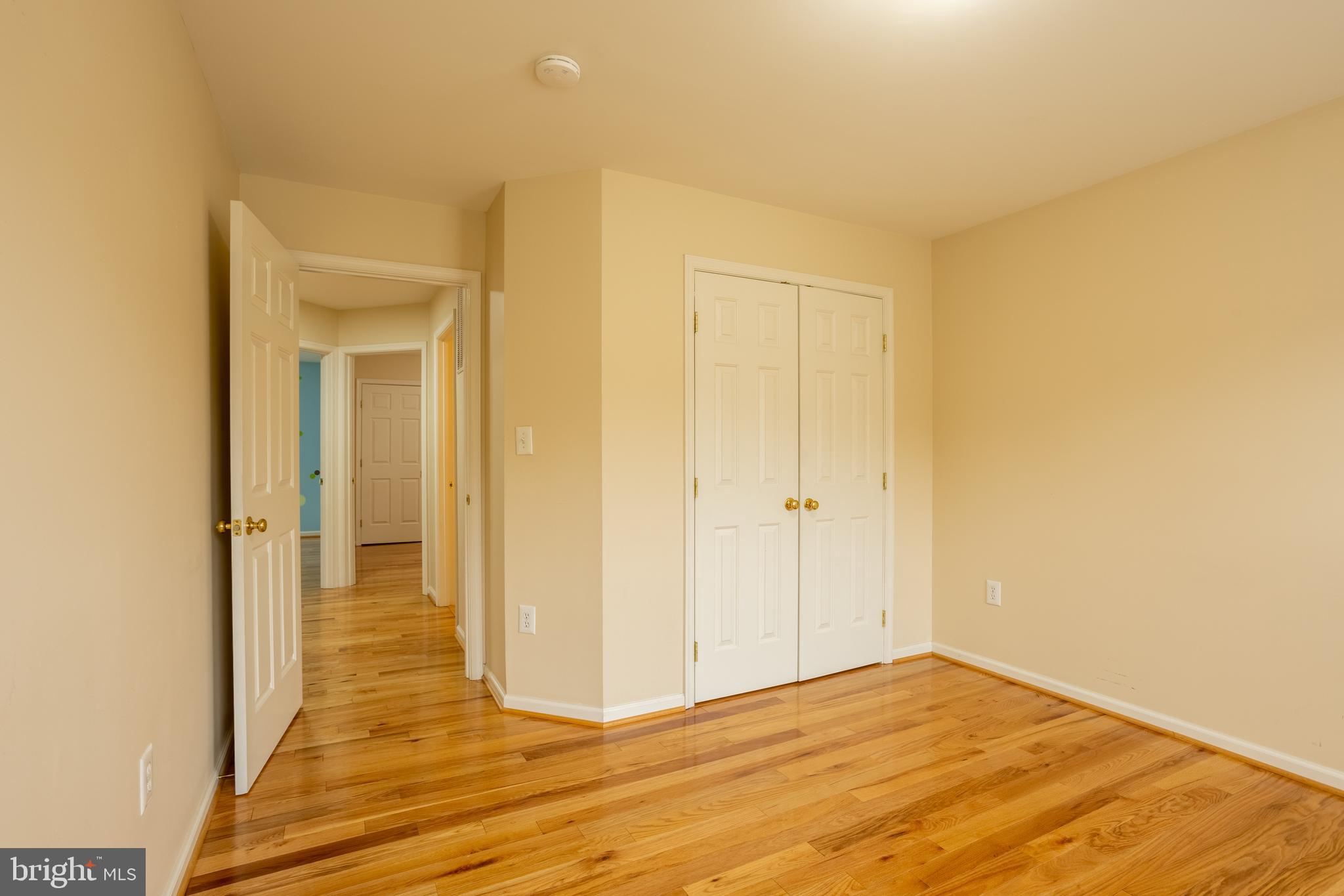 7740 Rotherham Drive Hanover, MD 21076 - Photo 34 of 62 a view of a livingroom with wooden floor and a hallway
