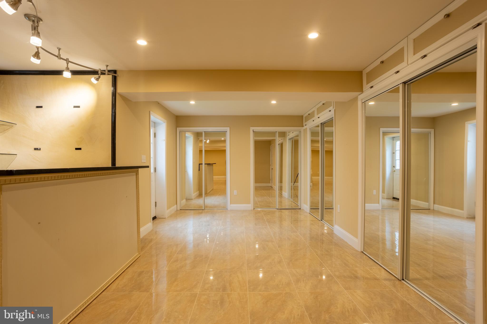 7740 Rotherham Drive Hanover, MD 21076 - Photo 47 of 62 a view of a hallway with wooden shelves