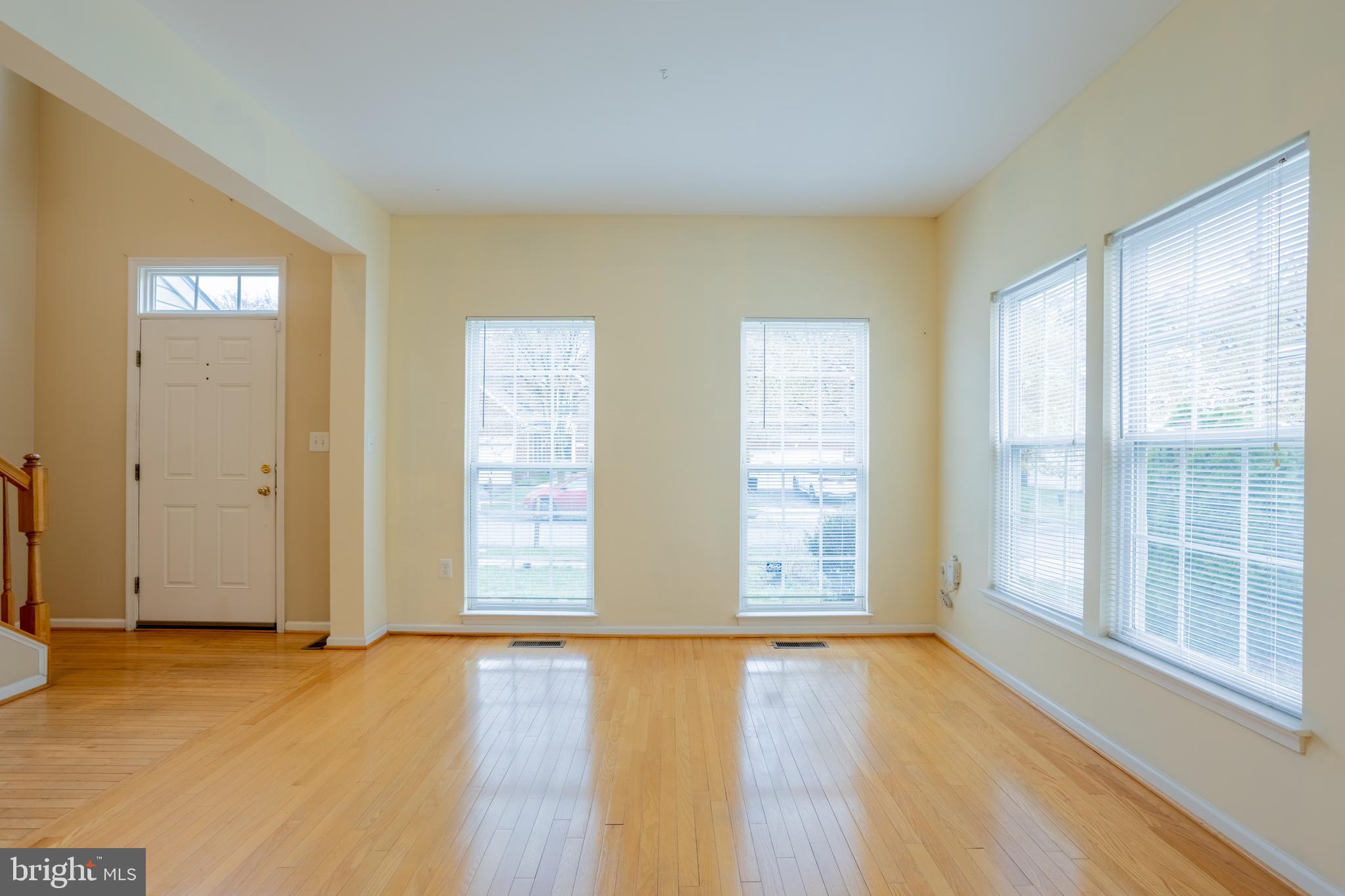 7740 Rotherham Drive Hanover, MD 21076 - Photo 5 of 62 an empty room with wooden floor and windows