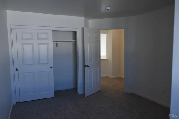 a view of hallway with closet