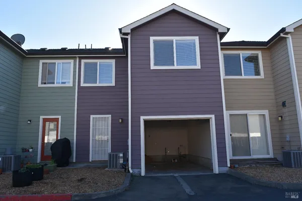 a view of street with tall buildings
