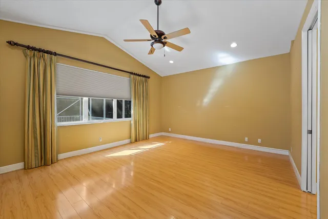 a large bathroom with a large tub and sink