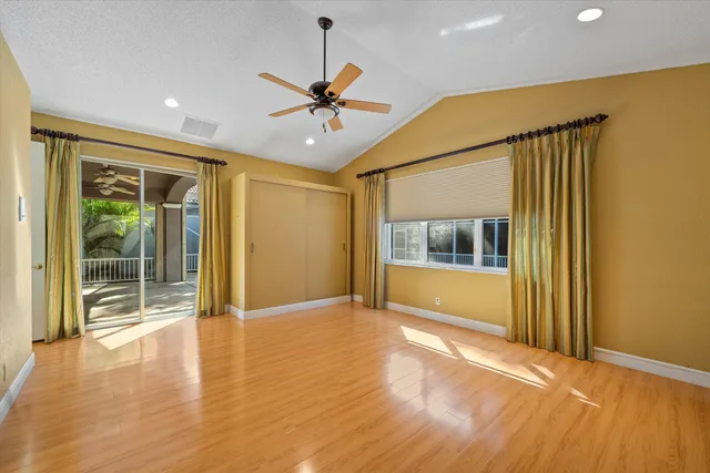 a bathroom with a granite countertop shower and a bathtub