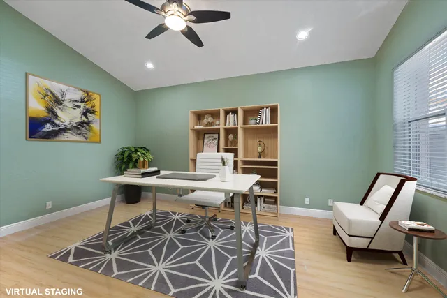 a view of a house with a backyard