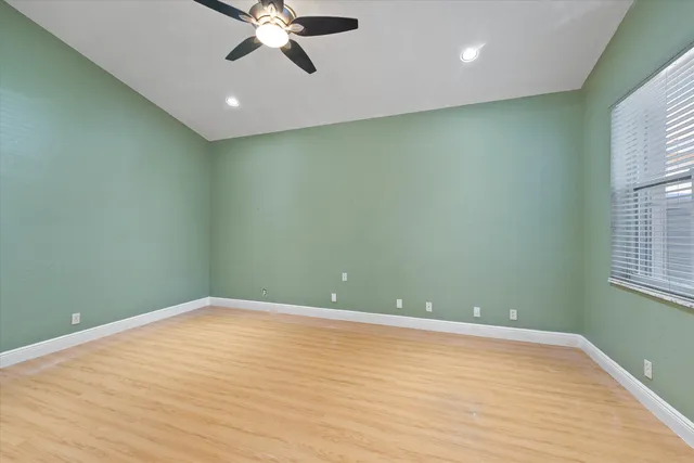 an aerial view of residential houses with outdoor space and swimming pool